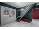 An entryway with a staircase and a dark-colored wall at 705 Whiteway Dr, Brooksville, FL 34601