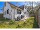 Side of house with AC unit and a small patio area at 705 Whiteway Dr, Brooksville, FL 34601