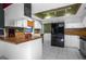 Eat-in kitchen with wood countertops and chalkboard wall at 705 Whiteway Dr, Brooksville, FL 34601