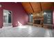 Living room with a stone fireplace and vaulted ceiling at 705 Whiteway Dr, Brooksville, FL 34601