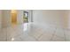 Bedroom with tile floors and sliding mirrored closet doors at 706 Haven Pl, Tarpon Springs, FL 34689