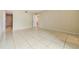 Spacious bedroom with tile floors and access to bathroom at 706 Haven Pl, Tarpon Springs, FL 34689