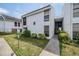 Two-story building exterior with walkway and landscaping at 706 Haven Pl, Tarpon Springs, FL 34689