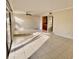 Bright and spacious living room with tile floor and access to a patio at 706 Haven Pl, Tarpon Springs, FL 34689