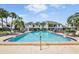 Inviting community pool with lounge chairs at 706 Haven Pl, Tarpon Springs, FL 34689