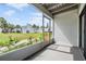 Private screened porch overlooking the community at 706 Haven Pl, Tarpon Springs, FL 34689