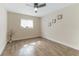Spacious bedroom with ceiling fan and wood-look tile flooring at 908 Victoria St, Brandon, FL 33510