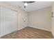 Well-lit bedroom with tile floors and double door closet at 908 Victoria St, Brandon, FL 33510