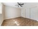 Well-lit bedroom featuring a ceiling fan and ample closet space at 908 Victoria St, Brandon, FL 33510