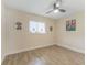 Bright bedroom with wood-look tile floors and double door closet at 908 Victoria St, Brandon, FL 33510