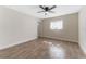 Bright bedroom with ceiling fan and wood-look tile flooring at 908 Victoria St, Brandon, FL 33510