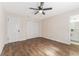 Spacious bedroom with ceiling fan, double door closet and ensuite bathroom at 908 Victoria St, Brandon, FL 33510