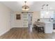 Dining area with barn door to kitchen and neutral decor at 908 Victoria St, Brandon, FL 33510