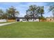 Newly renovated home with driveway and grassy yard at 908 Victoria St, Brandon, FL 33510