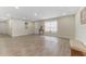 Open concept living room with kitchen access and neutral decor at 908 Victoria St, Brandon, FL 33510