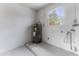 Clean utility room with water heater and window at 908 Victoria St, Brandon, FL 33510