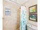 Updated bathroom featuring a shower and neutral tile at 10033 64Th N Ave # 16, St Petersburg, FL 33708