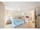 Spacious bedroom with ceiling fan and ensuite bathroom access at 10033 64Th N Ave # 16, St Petersburg, FL 33708