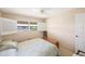 Bright bedroom with double bed and window shutters at 10033 64Th N Ave # 16, St Petersburg, FL 33708