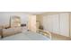 Comfortable bedroom with wicker dresser and built-in closet at 10033 64Th N Ave # 16, St Petersburg, FL 33708