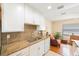 Modern kitchen with granite countertops and stainless steel sink at 10033 64Th N Ave # 16, St Petersburg, FL 33708