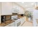 Kitchen with white cabinets, granite countertops, and stainless steel appliances at 10033 64Th N Ave # 16, St Petersburg, FL 33708