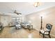 Living room with light beige walls, light wood flooring and comfy seating at 10033 64Th N Ave # 16, St Petersburg, FL 33708