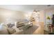 Living room with view into kitchen and light wood flooring at 10033 64Th N Ave # 16, St Petersburg, FL 33708
