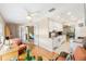 Open living room with hardwood floors and access to bedrooms at 10033 64Th N Ave # 16, St Petersburg, FL 33708
