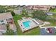 Community pool with lounge chairs and shaded areas at 10033 64Th N Ave # 16, St Petersburg, FL 33708