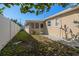 Landscaped backyard with screened patio at 1198 40Th Ne Ave, St Petersburg, FL 33703