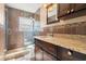 Bathroom with walk-in shower and granite countertop at 1198 40Th Ne Ave, St Petersburg, FL 33703