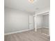 Spacious bedroom with mirrored closet doors and light grey walls at 1198 40Th Ne Ave, St Petersburg, FL 33703