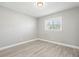 Spacious bedroom with hardwood floors and large window at 1198 40Th Ne Ave, St Petersburg, FL 33703