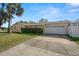 House exterior with driveway and garage at 1198 40Th Ne Ave, St Petersburg, FL 33703