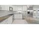 Modern kitchen with granite countertops and stainless steel appliances at 1198 40Th Ne Ave, St Petersburg, FL 33703