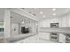 Open concept kitchen with granite island and stainless steel appliances at 1198 40Th Ne Ave, St Petersburg, FL 33703