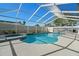 Inviting kidney-shaped pool with spa and screened enclosure at 1198 40Th Ne Ave, St Petersburg, FL 33703
