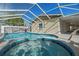 Inviting pool and spa with screened enclosure at 1198 40Th Ne Ave, St Petersburg, FL 33703