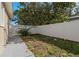Landscaped side yard with white fence at 1198 40Th Ne Ave, St Petersburg, FL 33703
