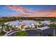 Aerial view of community clubhouse at sunset at 12094 New Tranquility Path, Venice, FL 34293