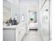 Spa-like bathroom with double vanity, large shower, and view into bedroom at 12094 New Tranquility Path, Venice, FL 34293