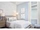 Bedroom with full-size bed, light blue walls, and wave decals at 12094 New Tranquility Path, Venice, FL 34293