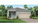One-story home with a light teal exterior, two-car garage, and landscaping at 12094 New Tranquility Path, Venice, FL 34293
