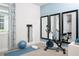 Home gym with exercise bike, yoga mat, and resistance bands at 12094 New Tranquility Path, Venice, FL 34293