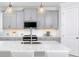 Modern kitchen with gray cabinets, white countertops and island at 12094 New Tranquility Path, Venice, FL 34293