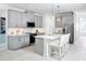 Modern kitchen with gray cabinets, white countertops and island at 12094 New Tranquility Path, Venice, FL 34293