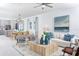 Open-concept living room with coastal decor and kitchen view at 12094 New Tranquility Path, Venice, FL 34293