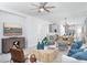 Living area with open concept to kitchen and coastal decor at 12094 New Tranquility Path, Venice, FL 34293