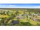 Aerial view highlighting the home's large private pond, manicured acreage, and peaceful surroundings at 12405 Stonelake Ranch Blvd, Thonotosassa, FL 33592